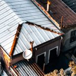 Drones And Satellites - An aerial view of a roof with a satellite dish