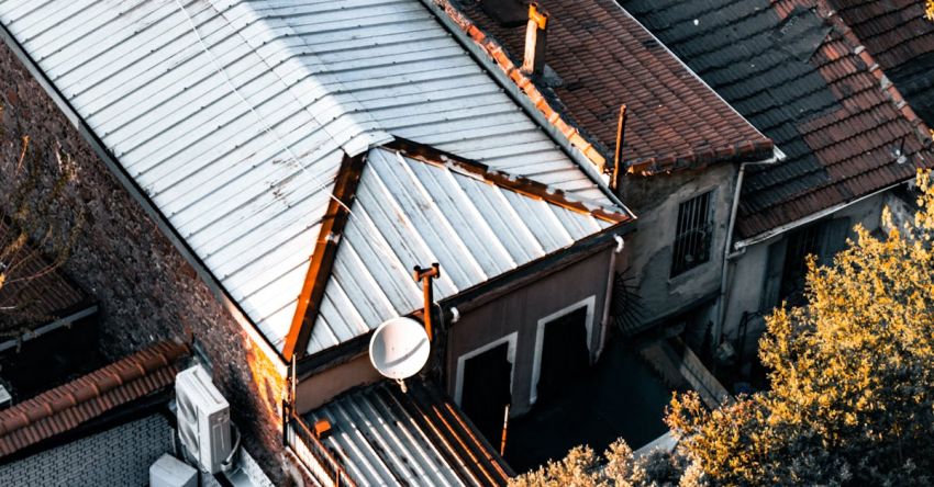 Drones And Satellites - An aerial view of a roof with a satellite dish