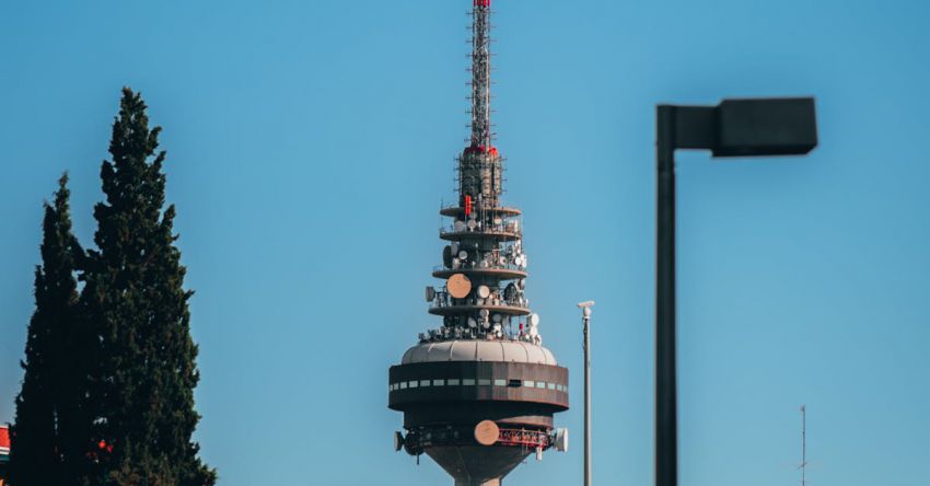 Agri-Tech - A tall tower with a red and white sign