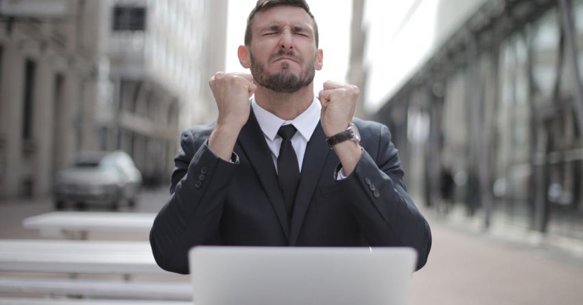 Agri-Tech Solutions - Man in Black Suit Sitting on Chair Beside Buildings