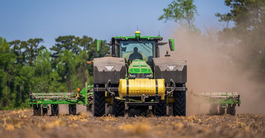 Seeders - A Tractor with a Seeder on a Cropland