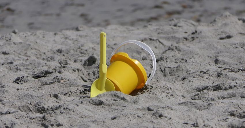 Soil Health - Yellow Plastic Bucket on Sand