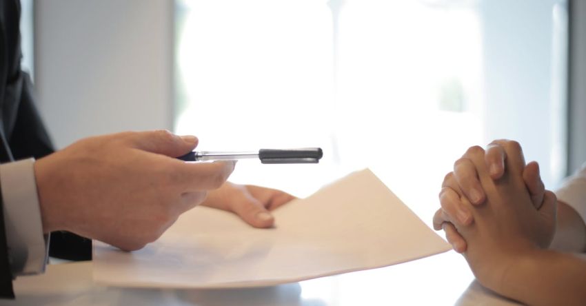 Crop Protection Technology - Crop businessman giving contract to woman to sign